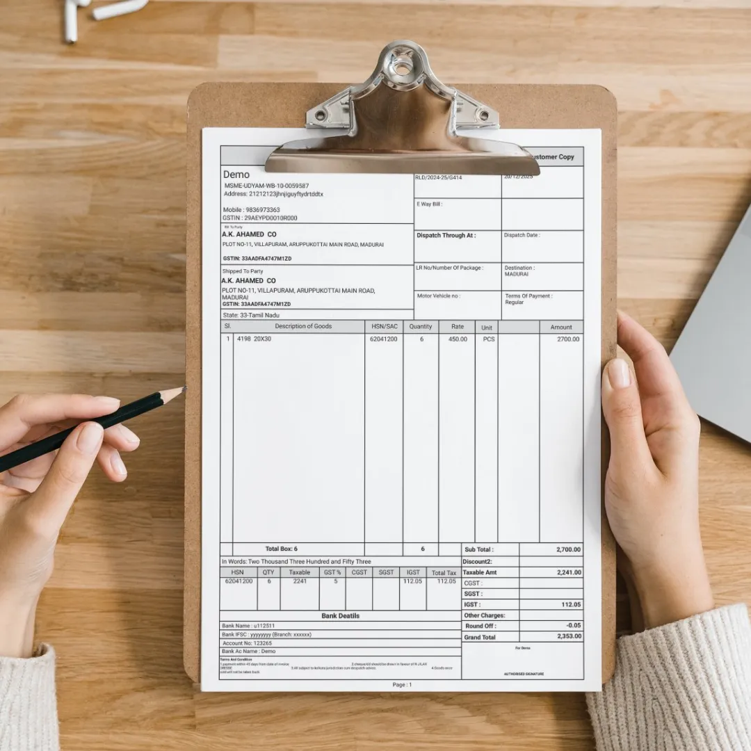 GST-compliant invoice for garment manufacturing business generated by Zubizi ERP with automatic 5% and 18% GST slabs for textiles and finished garments